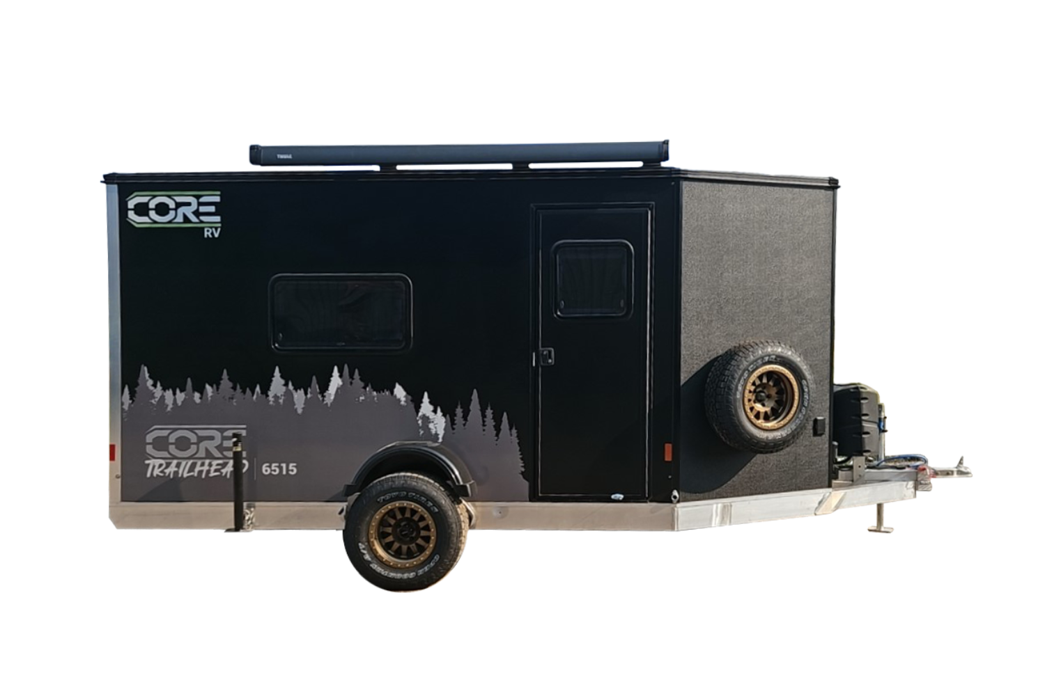 8032largelayout Exterior curbside view of the CORE RV 6515 Trailhead trailer, black with grey trees graphics and an awning mounted on top